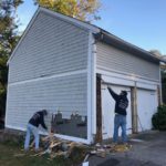 Siding removal during a garage renovation in East Greenwich, RI